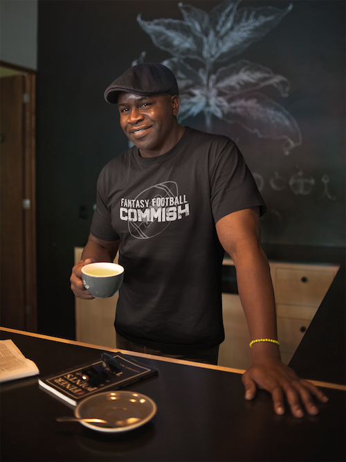 mockup-of-a-black-man-wearing-a-t-shirt-and-a-beret-having-a-coffee-a21423.png