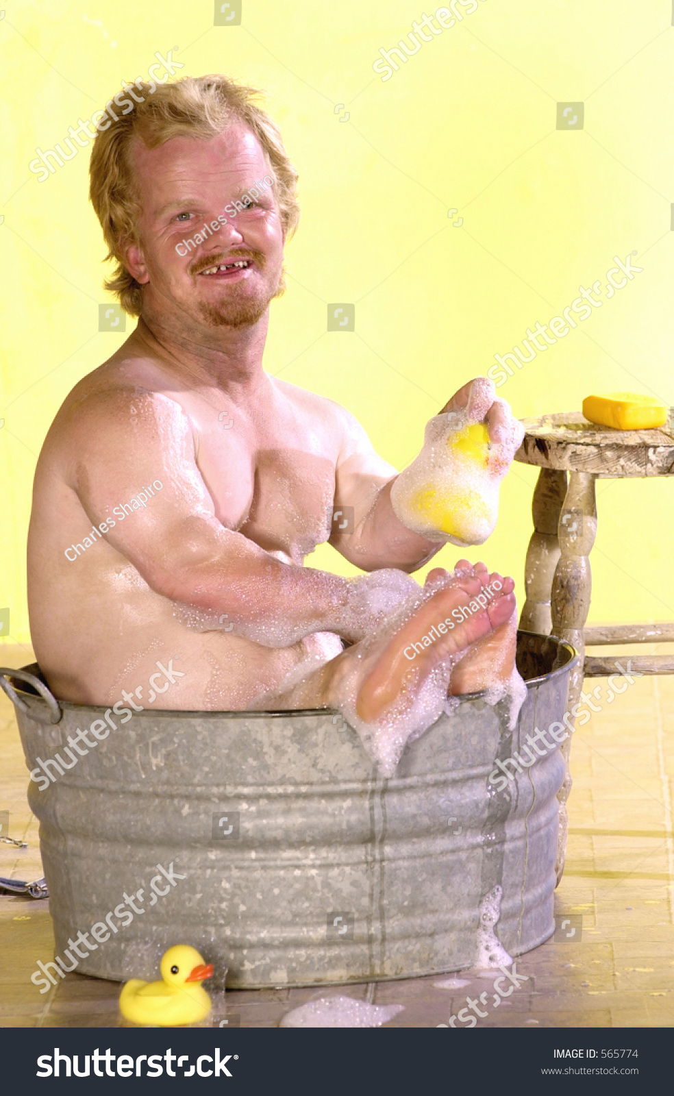 stock-photo-tiny-man-takes-a-bath-in-a-bucket-of-soapy-water-with-a-rubber-ducky-565774.jpg